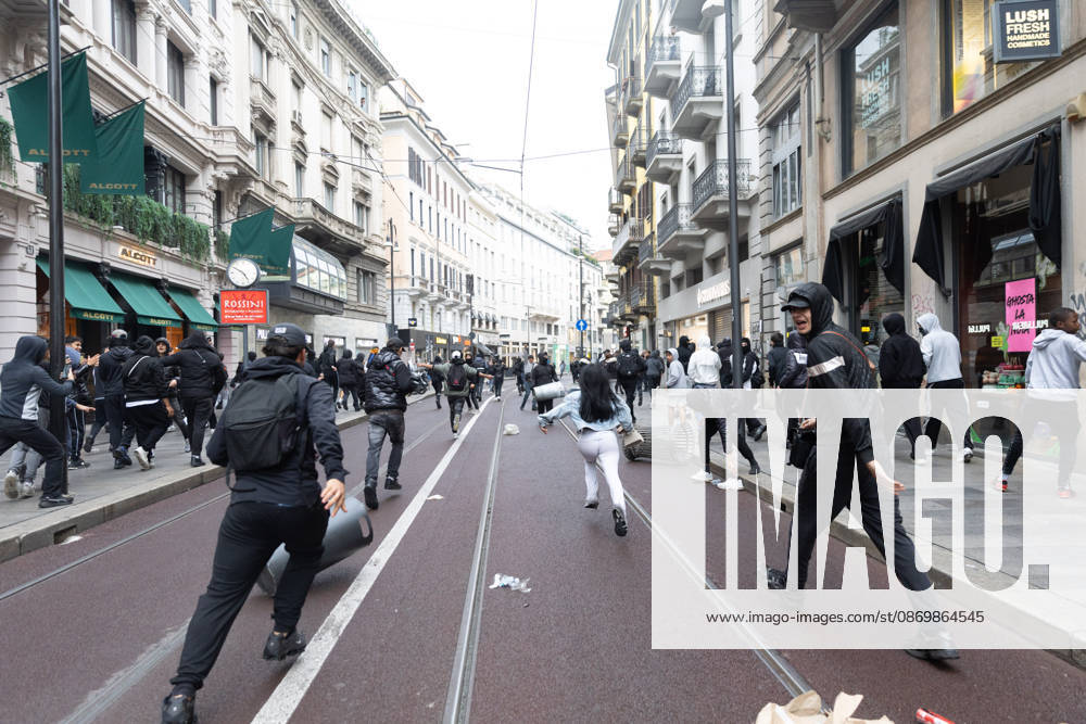IPA89867921 - Milan, October 18, 2026: More Clashes and Looting in Downtown Milan the Day After the Protest; Pictured: Via Torino Rioters Storm In