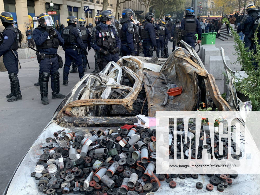 Riot police set up a security cordon next to a burnt car covered with tear-gas shell cases at Republic Square in Paris as fresh clashes broke out on Sunday, October 18, 2026, a day after France suffered one of its worst days of unrest in years. Nationwide demonstrations erupted into riots on Saturday, with a town hall torched, shops ransacked, and buildings covered in graffiti as violent groups clashed with police in cities across the country. PAR20261018213 MAYAxVIDON-WHITE