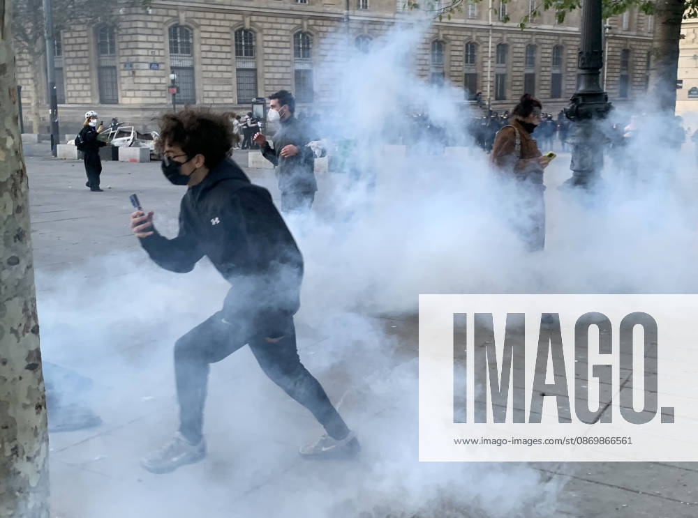 Rioters escape tear-gas thrown by security forces at Republic Square in Paris as fresh clashes broke out on Sunday, October 18, 2026, a day after France suffered one of its worst days of unrest in years. Nationwide demonstrations erupted into riots on Saturday, with a town hall torched, shops ransacked, and buildings covered in graffiti as violent groups clashed with police in cities across the country. PAR20261018215 MAYAxVIDON-WHITE