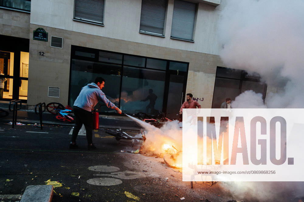 Local residents are trying to put out the barricade fires in front of their homes. Protesters gathered at Place de la RÃ publique the day after the demonstration on 17 October; the police used tear gas and water cannons to disperse them. Many found themselves in the surrounding streets. - 18 10 2026 - France Paris Paris - JanxSchmidt-Whitley LexPictorium LePictorium_0344284