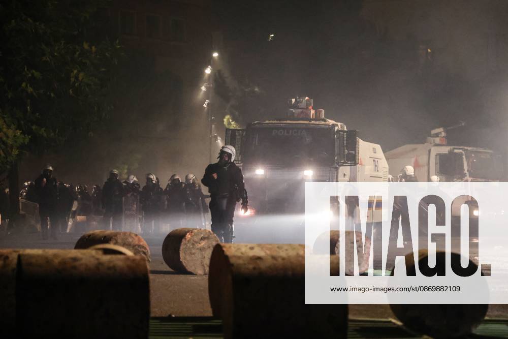 TIRANA, ALBANIA, OCTOBER 18, 2026: Demonstrators clash with riot police in Skanderbeg Square as student-led anti-government protests continue for a sixth consecutive day. Confrontations spread from the Ministry of Education to central Tirana, with protesters throwing stones and pyrotechnics while police deploy tear gas and water cannons. Demonstrators demand improved university conditions and the resignation of Prime Minister Edi Rama. Tirana Albania - ZUMAq101 20261018_zna_q101_226