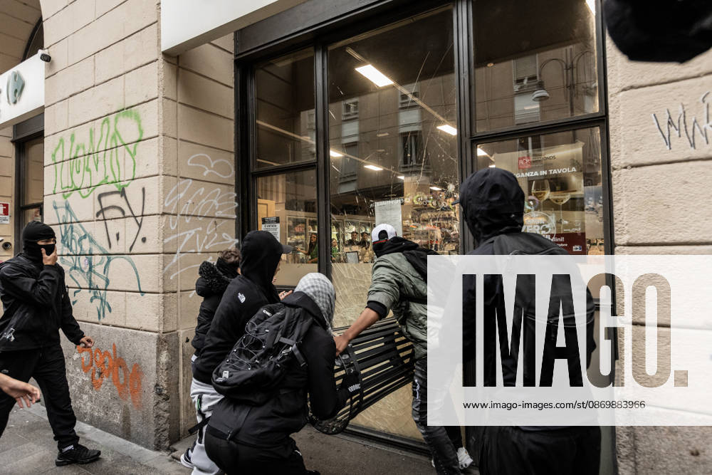 Police detain 160 as unrest continues for second day in Milan MILAN, ITALY - OCTOBER 18: Protesters vandalize a shop during protests in Milan, Italy, on October 18, 2026. Groups threw stones, bottles, firecrackers and barriers at police officers, who responded with tear gas and water cannon, while shops were damaged and looted around the city center and a Carabinieri vehicle was destroyed. Andrea Carrubba Anadolu Milan Italy. Editorial use only. Please get in touch for any other usage.