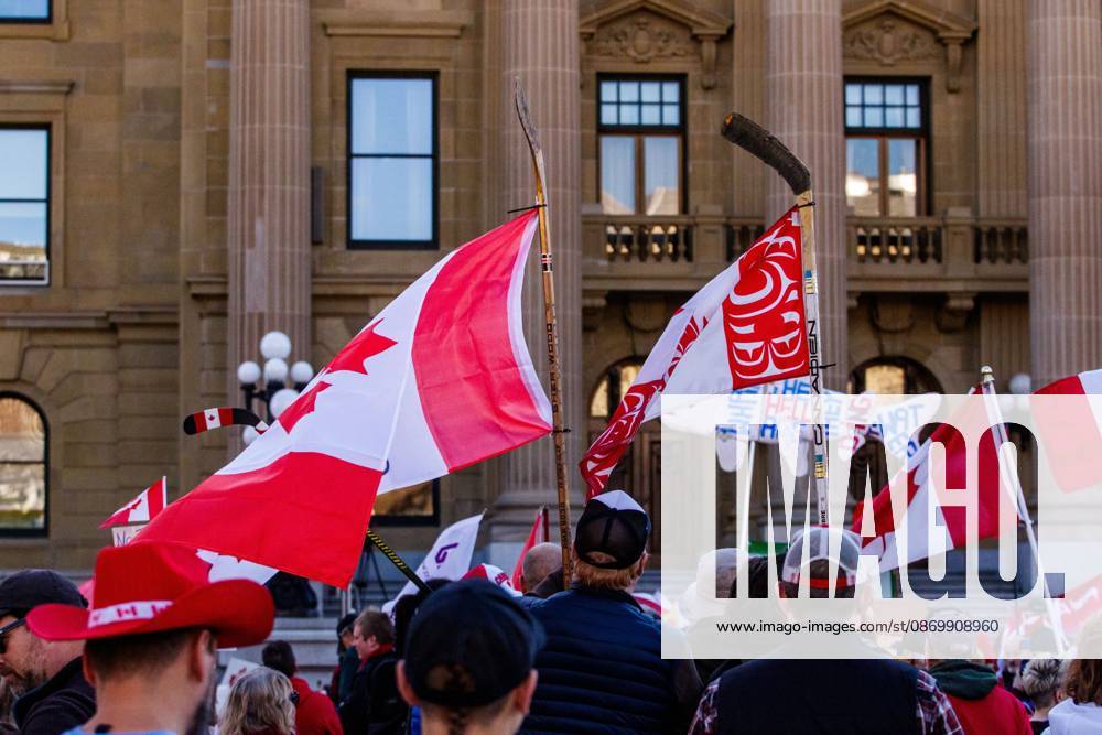 Attendees display both Canadian Design and Indigenous design of the Canadian Flag in support of the Alberta Federation of Labour s Canada Unity Rally ahead of the Alberta Referendum..With less than 24 hours until Referendum voting starts, the Alberta Federation of Labour and Fight Back supporters rallied at the Alberta Legislature grounds to support a Unified Alberta in Canada and oppose the prospect of separation from Canada. The group is opposed to the 9 other questions on the Alberta referendum ballots. Edmonton Canada - ZUMAs197 20261018_aaa_s197_657