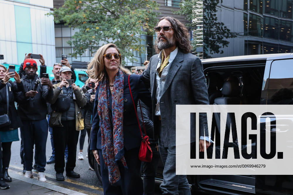 RUSSELL BRAND and his wife, LAURA BRAND, arrive together at Southwark Crown Court in London, on October 19, 2026, for his trial on rape and sexual assault charges, which he denies. London United Kingdom - ZUMAa279 20261019_zsp_a279_003