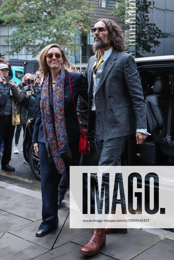 RUSSELL BRAND and his wife, LAURA BRAND, arrive together at Southwark Crown Court in London, on October 19, 2026, for his trial on rape and sexual assault charges, which he denies. London United Kingdom - ZUMAa279 20261019_zsp_a279_001
