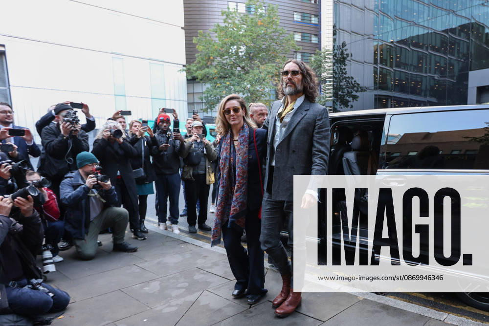 RUSSELL BRAND and his wife, LAURA BRAND, arrive together at Southwark Crown Court in London, on October 19, 2026, for his trial on rape and sexual assault charges, which he denies. London United Kingdom - ZUMAa279 20261019_zsp_a279_004