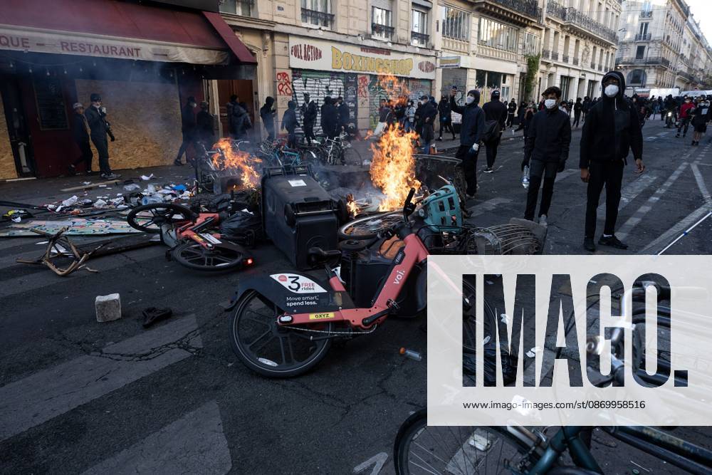 Second day of Paris riots PARIS, FRANCE - OCTOBER 18, 2026: Protesters clash with police near Place de la RÃ publique in Paris during a protest against austerity. Protesters set up makeshift barricades and start fires in the square and surrounding streets. After police clear the square, protesters attack nearby shops. Paris France