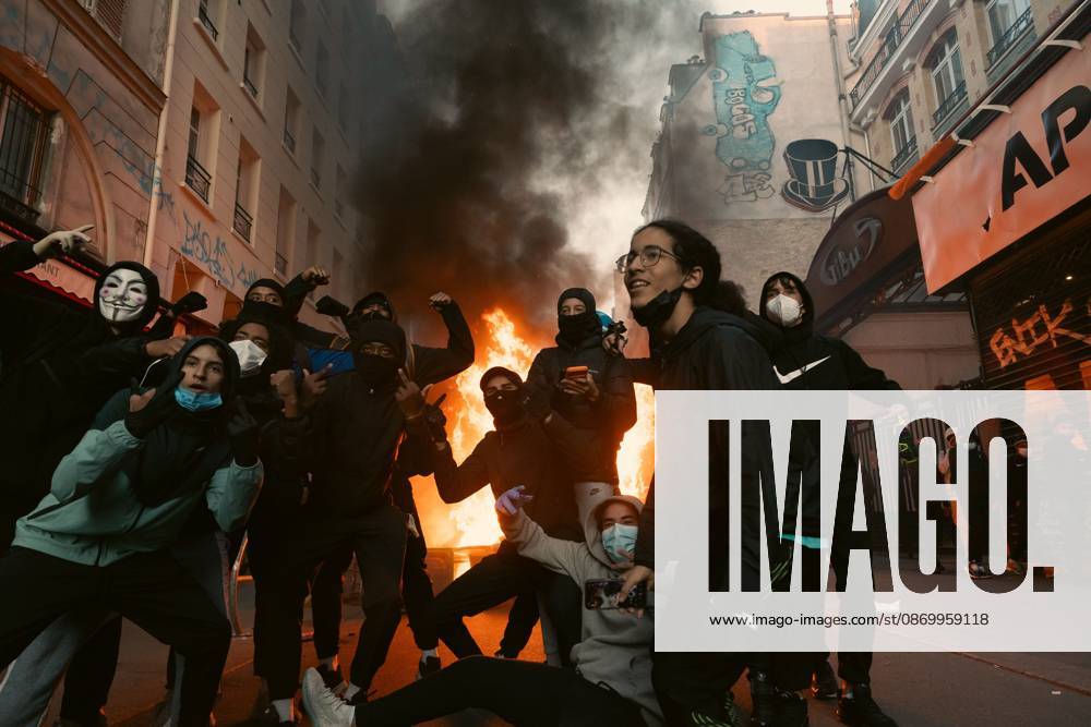 PARIS, FRANCE - OCTOBER 18, 2026: Protesters clash with police near Place de la RÃ publique in Paris during a protest against austerity. Protesters set up makeshift barricades and start fires in the square and surrounding streets. After police clear the square, protesters attack nearby shops. Paris France - ZUMAq101 20261018_zna_q101_292