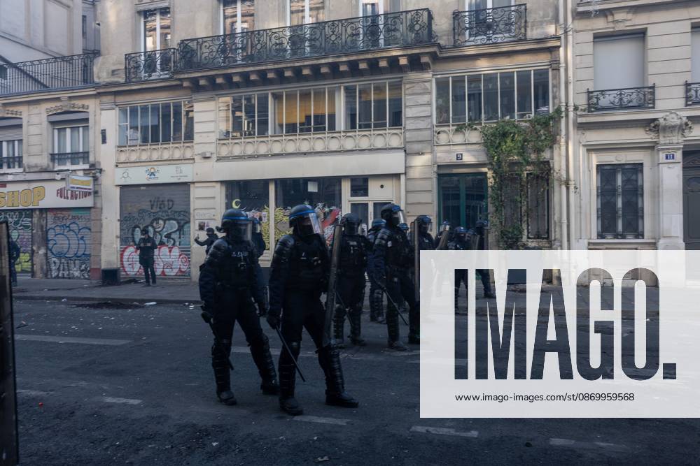 PARIS, FRANCE - OCTOBER 18, 2026: Protesters clash with police near Place de la RÃ publique in Paris during a protest against austerity. Protesters set up makeshift barricades and start fires in the square and surrounding streets. After police clear the square, protesters attack nearby shops. Paris France - ZUMAq101 20261018_zna_q101_299