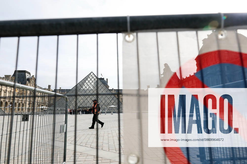 (261019) -- PARIS, Oct. 19, 2026 -- Security personnel stand guard in front of the Louvre Museum in Paris, France, Oct. 19, 2026. In Paris, the entrance to the Louvre Museum was blocked by student protesters on Monday morning, French daily Le Parisien reported, citing the museum s management and two trade unions. According to the trade union General Confederation of Labour, the museum would remain closed at least until noon. ) FRANCE-PARIS-LOUVRE MUSEUM-PROTEST WuxHuiwo
