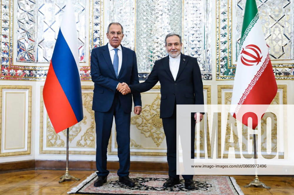 IRAN, TEHRAN - OCTOBER 19, 2026: Sergei Lavrov (L), Russia’s Minister of Foreign Affairs, and his counterpart Abbas Araghchi of Iran shake hands during their meeting. Best quality available. Russian Foreign Ministry TASS 99613919