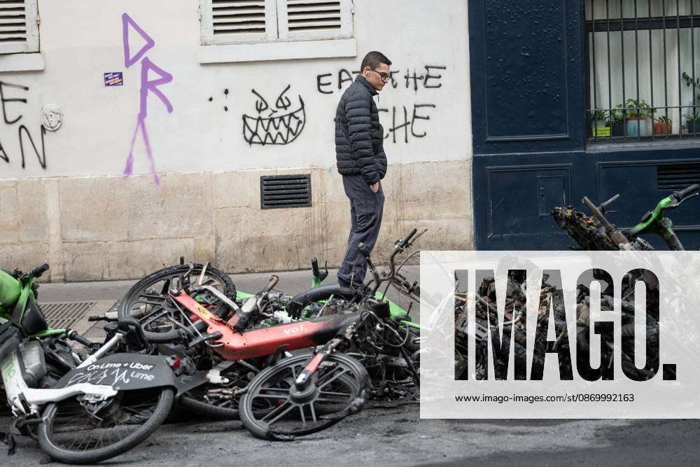 Shops Looted After the October 17th Demonstration - Paris AJ This photo shows a passerby looking at bicycles that have been charred, burned, and destroyed on October 19, 2026 two days after riots and looting occurred (pillage) on the sidelines of nationwide cost-of-living demonstrations. Photo by Alexis Jumeau ABACAPRESS.COM Paris France