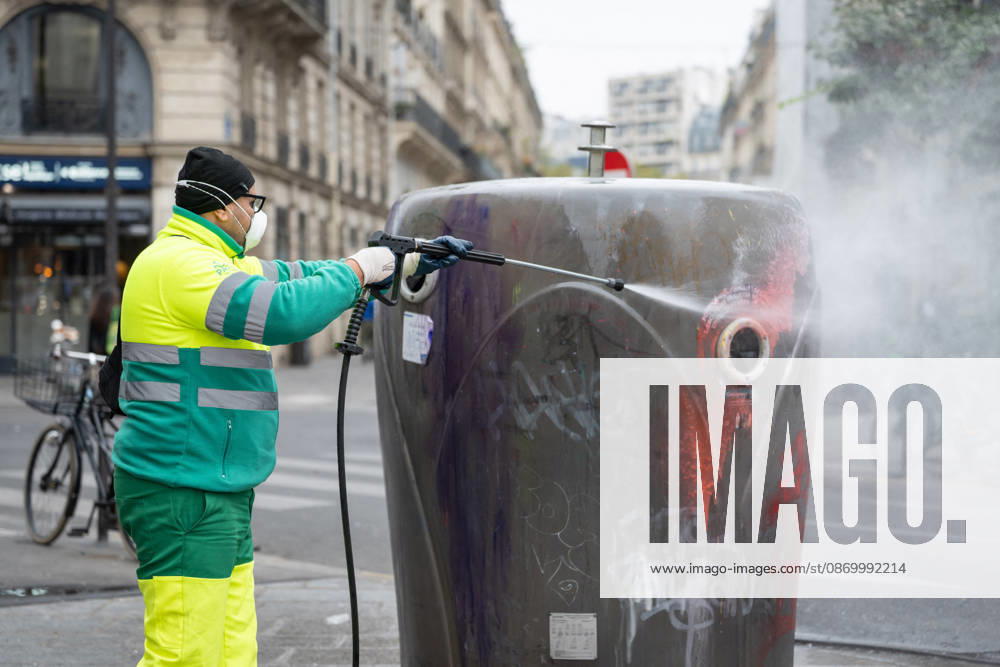 Shops Looted After the October 17th Demonstration - Paris AJ This photo shows a Paris city hall employee cleaning graffiti off a trash can using a high-pressure water jet and cleaning products on October 19, 2026 two days after riots and looting occurred (pillage) on the sidelines of nationwide cost-of-living demonstrations. Photo by Alexis Jumeau ABACAPRESS.COM Paris France