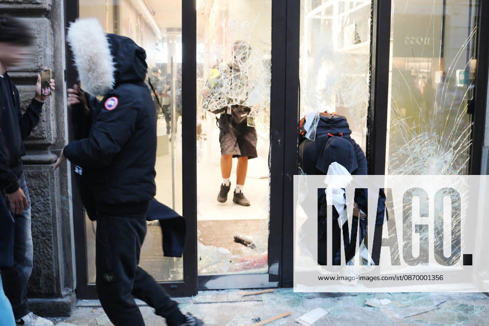 IPA89923821 - Milan, October 18, 2026: More Clashes and Looting in Downtown Milan in the Wake of the Protest; Store Stormed and Raided