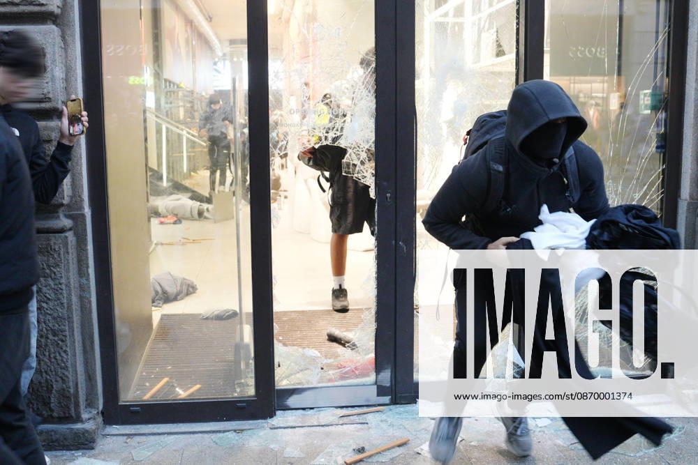 IPA89923824 - Milan, October 18, 2026: More Clashes and Looting in Downtown Milan in the Wake of the Protest; Store Stormed and Ransacked