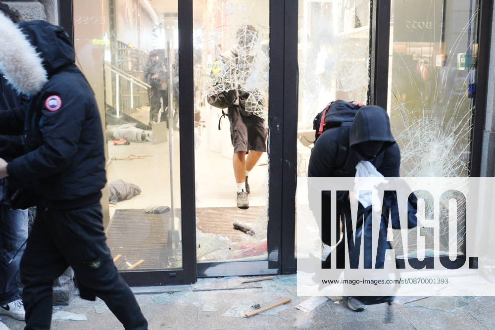 IPA89923828 - Milan, October 18, 2026: More Clashes and Looting in Downtown Milan in the Wake of the Protest; Under Armour Store on Via Orefici Stormed and Ransacked