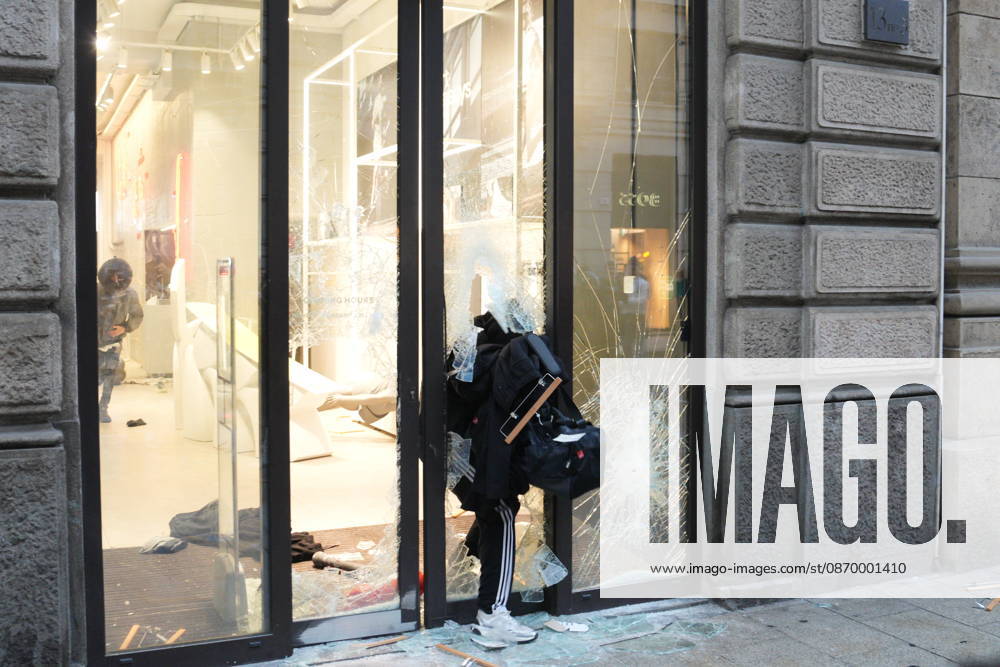 IPA89923832 - Milan, October 18, 2026: More Clashes and Looting in Downtown Milan in the Wake of the Protest; Under Armour Store on Via Orefici Stormed and Ransacked