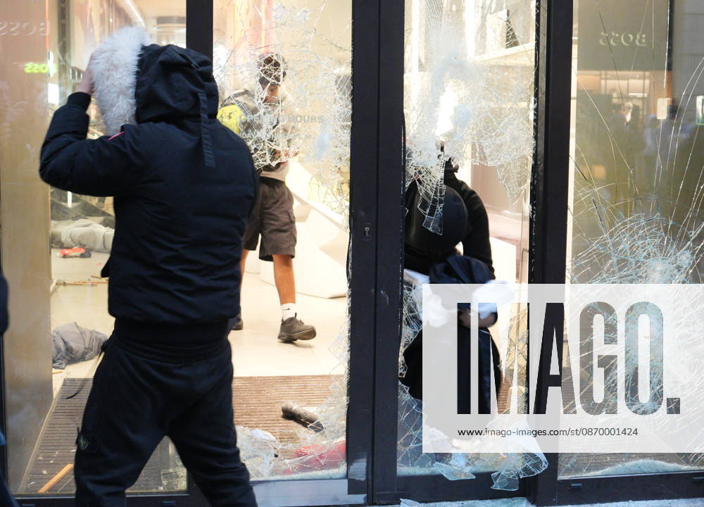 IPA89923835 - Milan, October 18, 2026: More Clashes and Looting in Downtown Milan in the Wake of the Protest; Under Armour Store on Via Orefici Stormed and Ransacked