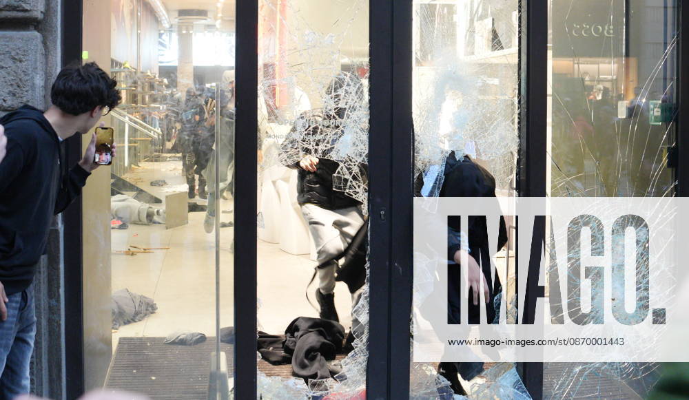 IPA89923840 - Milan, October 18, 2026: More Clashes and Looting in Downtown Milan in the Wake of the Protest; Under Armour Store on Via Orefici Stormed and Ransacked