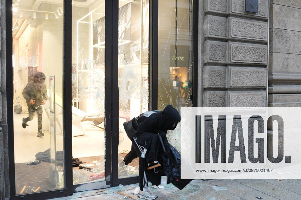 IPA89923848 - Milan, October 18, 2026: More Clashes and Looting in Downtown Milan in the Wake of the Protest; Under Armour Store on Via Orefici Stormed and Ransacked