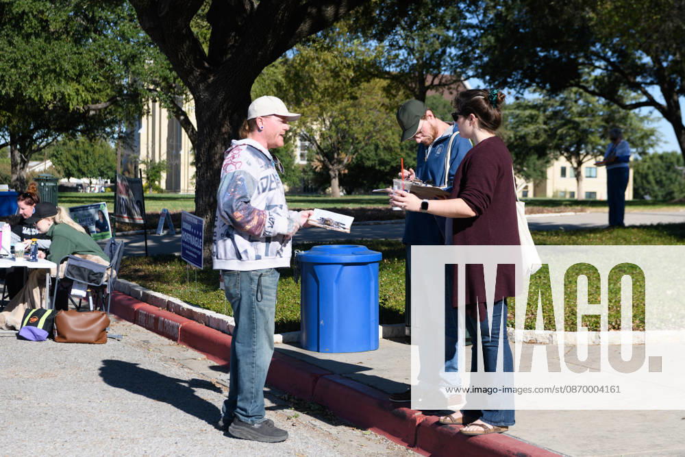 Early voting started in Dallas TX on Monday morning...Samuell Grand Recreation Center..Collecting signatures for a local ballot iniative. Dallas USA - ZUMAa183 20261019_znp_a183_008