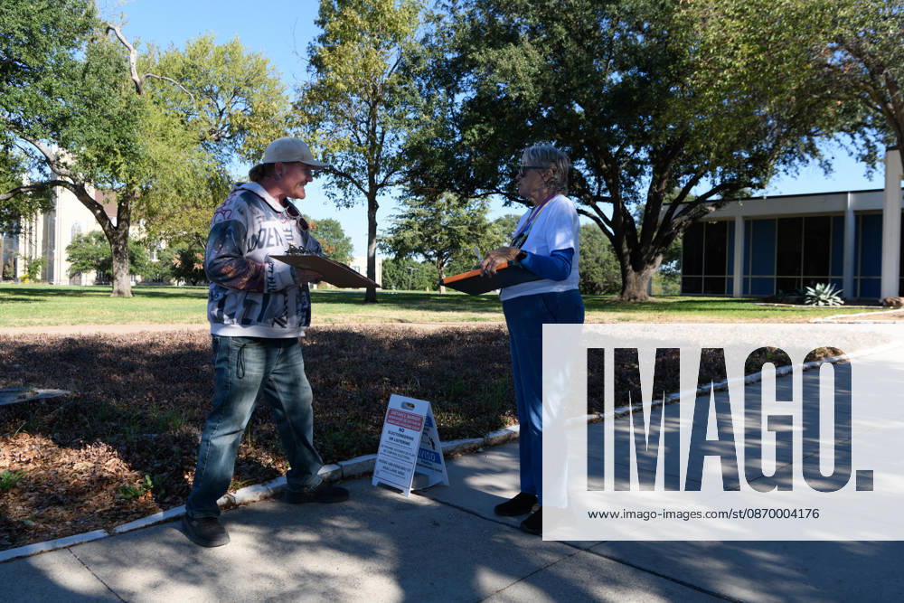 Early voting started in Dallas TX on Monday morning...Samuell Grand Recreation Center..Collecting signatures for a local ballot iniative. Dallas USA - ZUMAa183 20261019_znp_a183_009