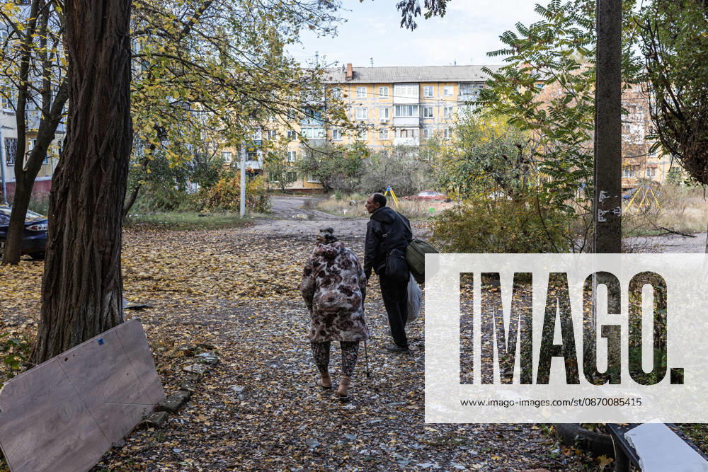 Russian airstrike hits residential building in Kramatorsk KRAMATORSK, UKRAINE - OCTOBER 20: Two people walk out of a damaged building following a Russian air strike on a residential block in Kramatorsk, Ukraine, on October 20, 2026. Diego Herrera Carcedo Anadolu Kramatorsk Ukraine. Editorial use only. Please get in touch for any other usage.