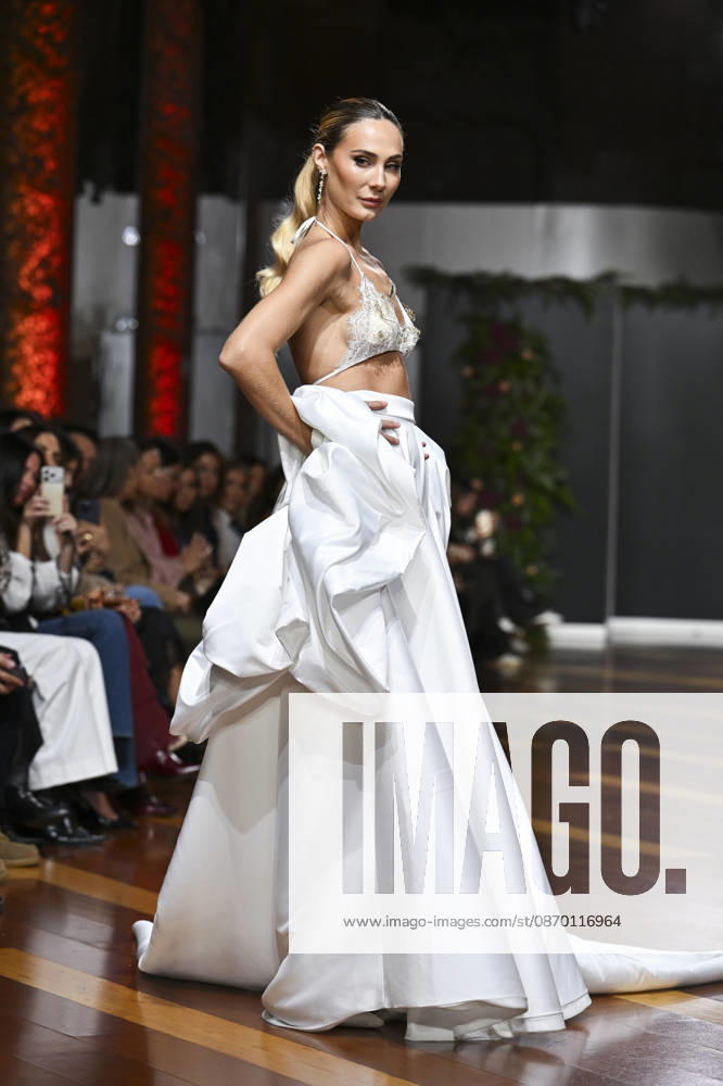 A model parades with design Genoveva Hita during Atelier Couture 16 Fashion Week Madrid Real Fabrica de Tapices in Madrid. Madrid Spain - ZUMAs197 20261020_aaa_s197_097