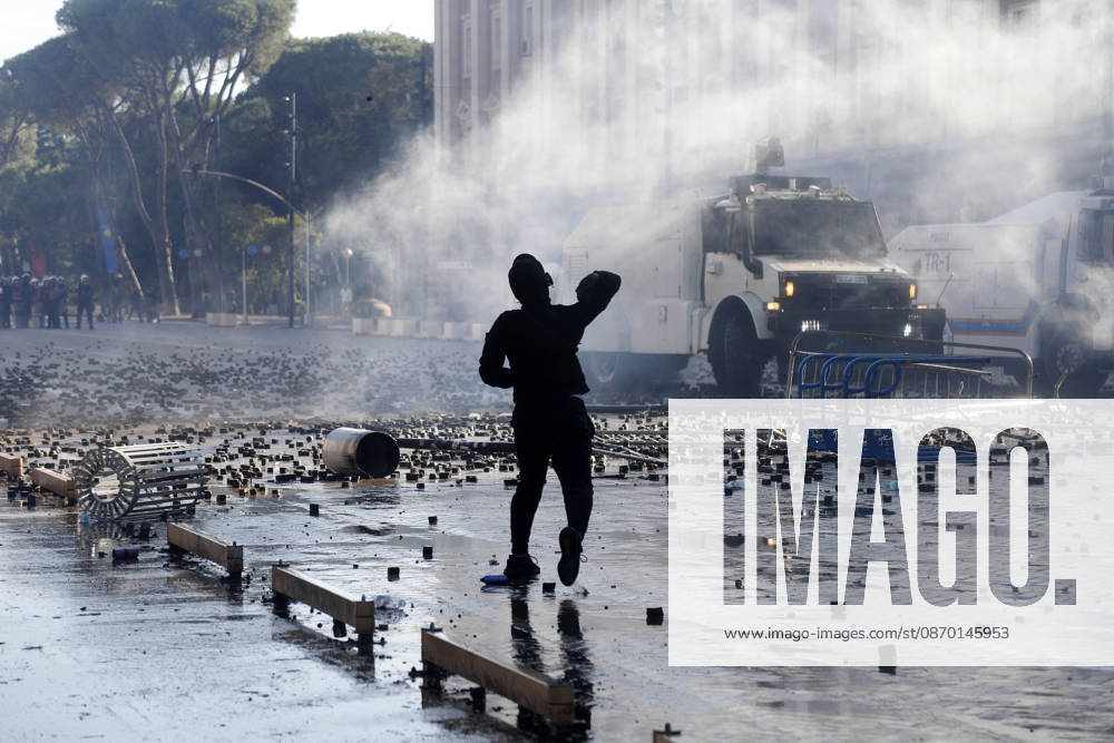 Protesters Clash with Police During a Demonstration in Tirana, Albania. Protesters throw stones towards Albanian Police officers during during an anti-government demonstration in central Tirana on October 17, 2026, as protests continued for a fifth consecutive day over university conditions and demands for the resignation of Albanian Prime Minister Edi Rama. The latest rally follows four nights of violence in the capital, during which protesters and riot police clashed, police used water cannons and tear gas, and demonstrators damaged government offices and shops and set fire to several buildings. Light Studio Agency Malton Dibra Tirana Albania
