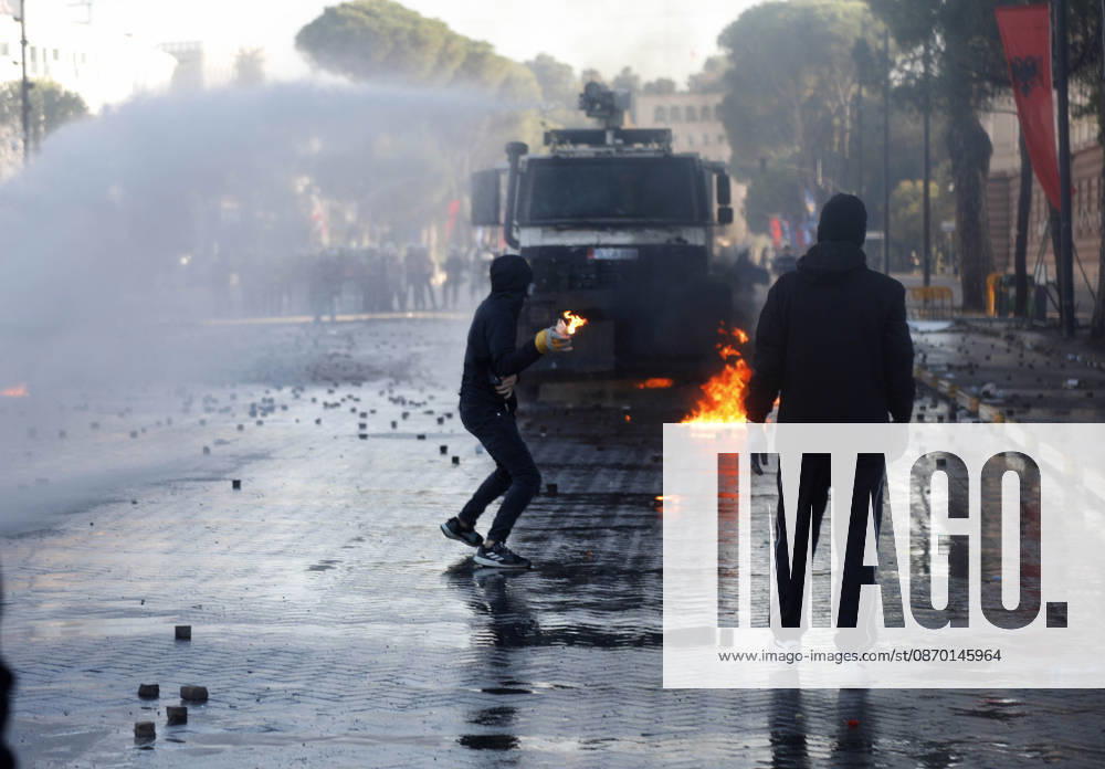 Protesters Clash with Police During a Demonstration in Tirana, Albania. Protesters throw molotov cocktails towards Albanian Police officers during during an anti-government demonstration in central Tirana on October 17, 2026, as protests continued for a fifth consecutive day over university conditions and demands for the resignation of Albanian Prime Minister Edi Rama. The latest rally follows four nights of violence in the capital, during which protesters and riot police clashed, police used water cannons and tear gas, and demonstrators damaged government offices and shops and set fire to several buildings. Light Studio Agency Malton Dibra Tirana Albania