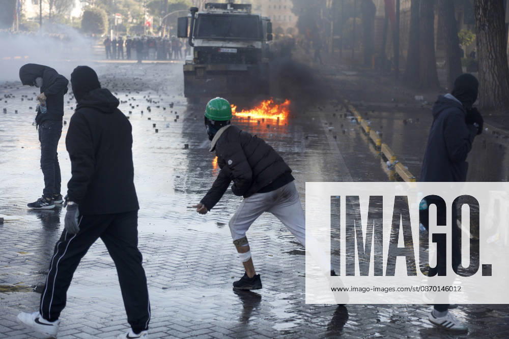 Protesters Clash with Police During a Demonstration in Tirana, Albania. Protesters throw molotov cocktails towards Albanian Police officers during during an anti-government demonstration in central Tirana on October 17, 2026, as protests continued for a fifth consecutive day over university conditions and demands for the resignation of Albanian Prime Minister Edi Rama. The latest rally follows four nights of violence in the capital, during which protesters and riot police clashed, police used water cannons and tear gas, and demonstrators damaged government offices and shops and set fire to several buildings. Light Studio Agency Malton Dibra Tirana Albania