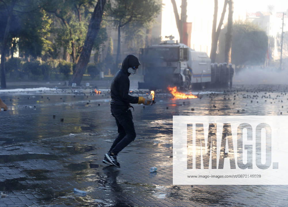 Protesters Clash with Police During a Demonstration in Tirana, Albania. Protesters throw molotov cocktails towards Albanian Police officers during during an anti-government demonstration in central Tirana on October 17, 2026, as protests continued for a fifth consecutive day over university conditions and demands for the resignation of Albanian Prime Minister Edi Rama. The latest rally follows four nights of violence in the capital, during which protesters and riot police clashed, police used water cannons and tear gas, and demonstrators damaged government offices and shops and set fire to several buildings. Light Studio Agency Malton Dibra Tirana Albania