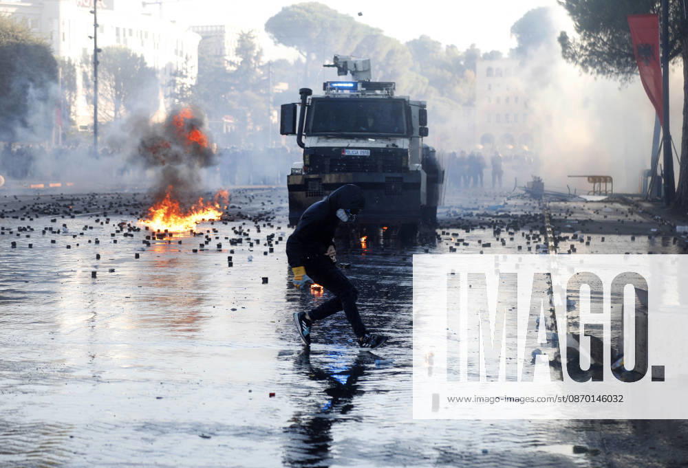 Protesters Clash with Police During a Demonstration in Tirana, Albania. Protesters throw molotov cocktails towards Albanian Police officers during during an anti-government demonstration in central Tirana on October 17, 2026, as protests continued for a fifth consecutive day over university conditions and demands for the resignation of Albanian Prime Minister Edi Rama. The latest rally follows four nights of violence in the capital, during which protesters and riot police clashed, police used water cannons and tear gas, and demonstrators damaged government offices and shops and set fire to several buildings. Light Studio Agency Malton Dibra Tirana Albania