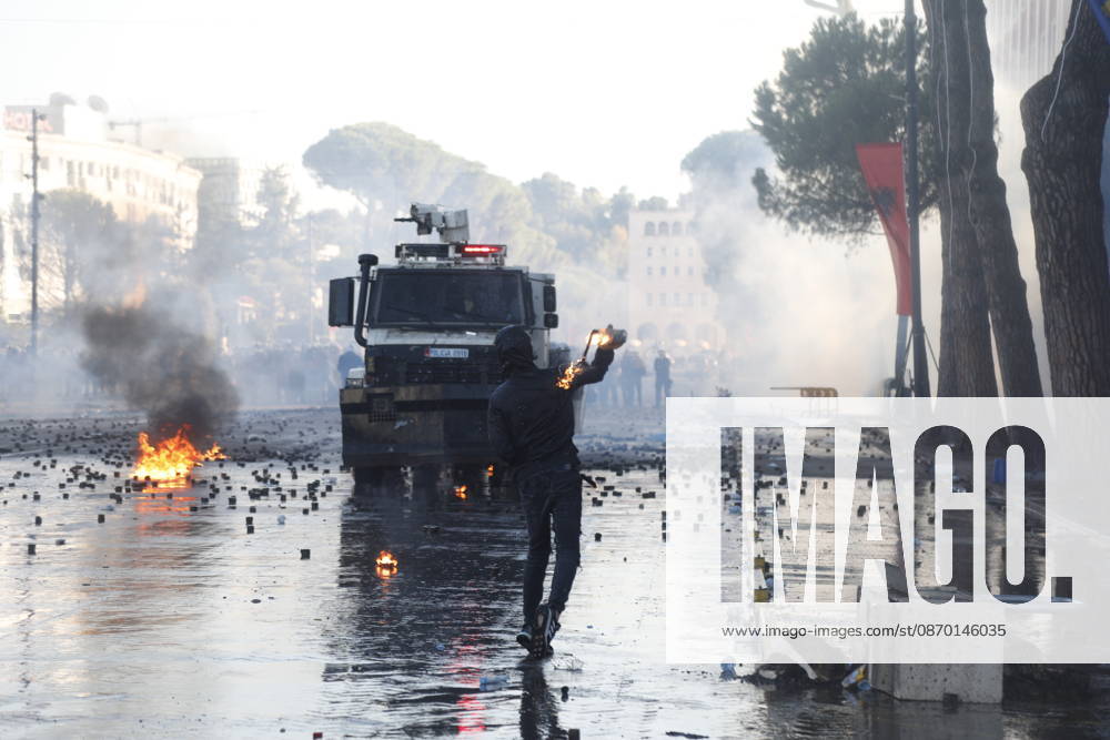 Protesters Clash with Police During a Demonstration in Tirana, Albania. Protesters throw molotov cocktails towards Albanian Police officers during during an anti-government demonstration in central Tirana on October 17, 2026, as protests continued for a fifth consecutive day over university conditions and demands for the resignation of Albanian Prime Minister Edi Rama. The latest rally follows four nights of violence in the capital, during which protesters and riot police clashed, police used water cannons and tear gas, and demonstrators damaged government offices and shops and set fire to several buildings. Light Studio Agency Malton Dibra Tirana Albania