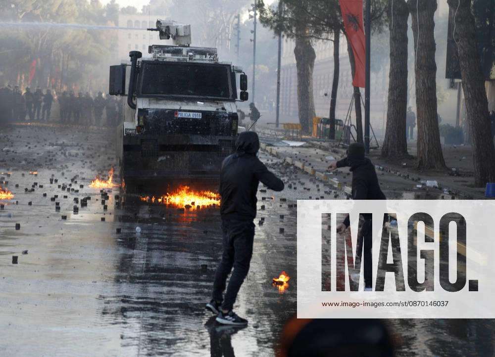 Protesters Clash with Police During a Demonstration in Tirana, Albania. Protesters throw molotov cocktails towards Albanian Police officers during during an anti-government demonstration in central Tirana on October 17, 2026, as protests continued for a fifth consecutive day over university conditions and demands for the resignation of Albanian Prime Minister Edi Rama. The latest rally follows four nights of violence in the capital, during which protesters and riot police clashed, police used water cannons and tear gas, and demonstrators damaged government offices and shops and set fire to several buildings. Light Studio Agency Malton Dibra Tirana Albania
