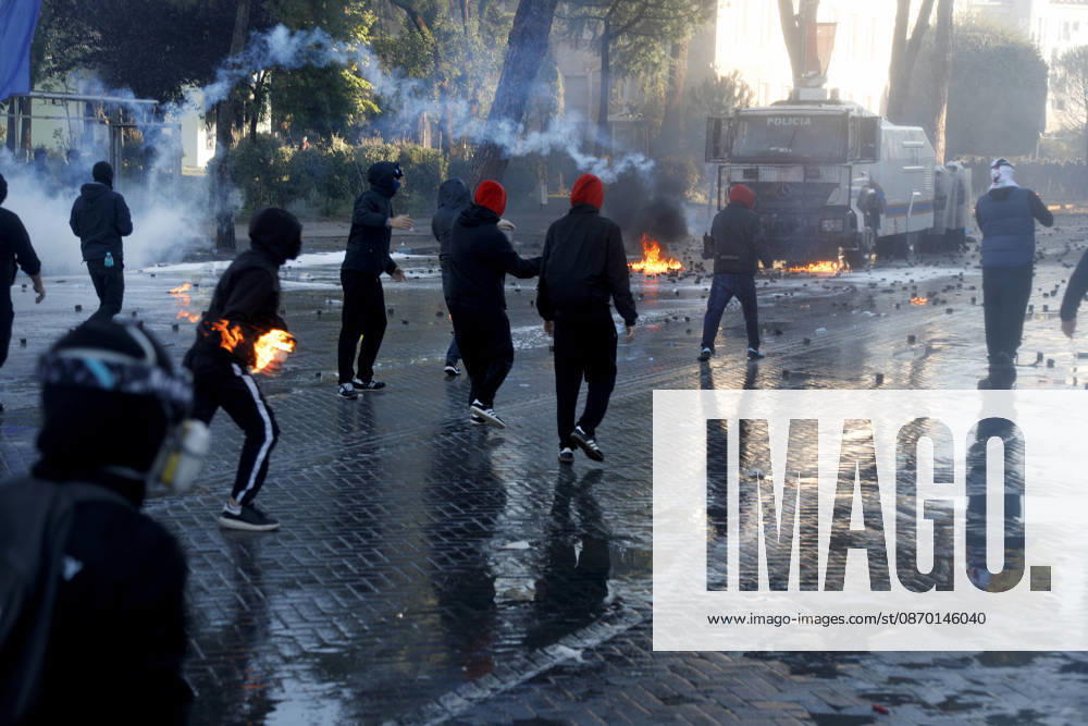Protesters Clash with Police During a Demonstration in Tirana, Albania. Protesters throw molotov cocktails towards Albanian Police officers during during an anti-government demonstration in central Tirana on October 17, 2026, as protests continued for a fifth consecutive day over university conditions and demands for the resignation of Albanian Prime Minister Edi Rama. The latest rally follows four nights of violence in the capital, during which protesters and riot police clashed, police used water cannons and tear gas, and demonstrators damaged government offices and shops and set fire to several buildings. Light Studio Agency Malton Dibra Tirana Albania