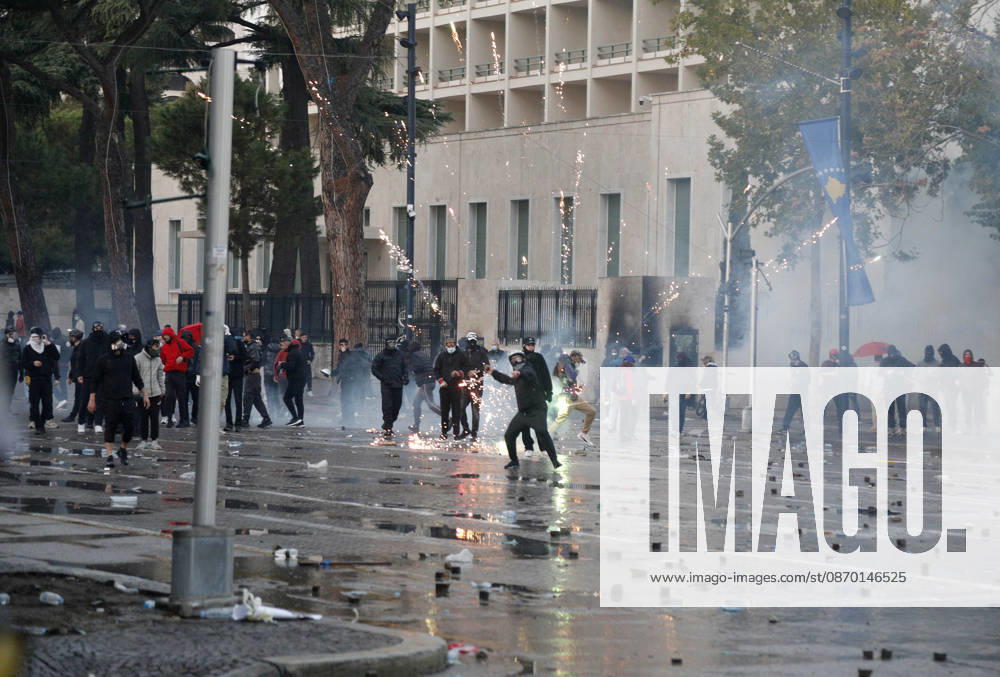 Protesters Clash with Police During a Demonstration in Tirana, Albania. Protesters throw stones towards Albanian Police officers during during an anti-government demonstration in central Tirana on October 17, 2026, as protests continued for a fifth consecutive day over university conditions and demands for the resignation of Albanian Prime Minister Edi Rama. The latest rally follows four nights of violence in the capital, during which protesters and riot police clashed, police used water cannons and tear gas, and demonstrators damaged government offices and shops and set fire to several buildings. Light Studio Agency Malton Dibra Tirana Albania