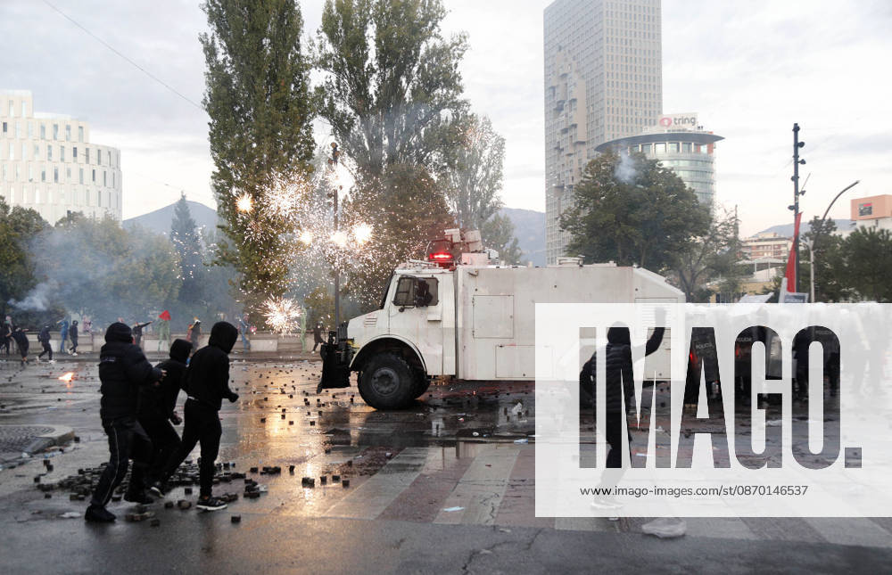 Protesters Clash with Police During a Demonstration in Tirana, Albania. Protesters throw stones towards Albanian Police officers during during an anti-government demonstration in central Tirana on October 17, 2026, as protests continued for a fifth consecutive day over university conditions and demands for the resignation of Albanian Prime Minister Edi Rama. The latest rally follows four nights of violence in the capital, during which protesters and riot police clashed, police used water cannons and tear gas, and demonstrators damaged government offices and shops and set fire to several buildings. Light Studio Agency Malton Dibra Tirana Albania