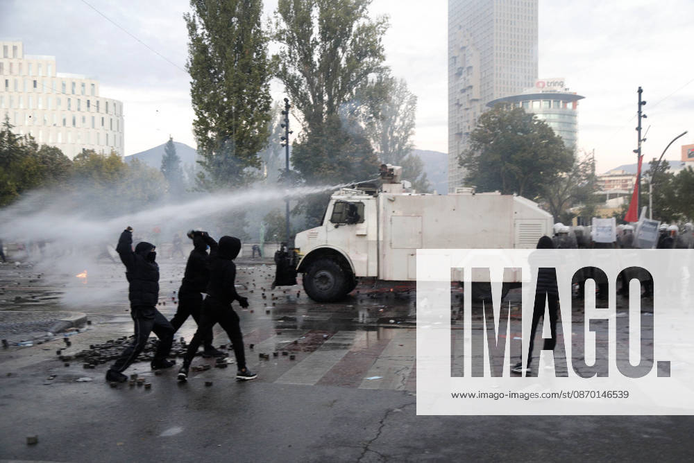 Protesters Clash with Police During a Demonstration in Tirana, Albania. Protesters throw stones towards Albanian Police officers during during an anti-government demonstration in central Tirana on October 17, 2026, as protests continued for a fifth consecutive day over university conditions and demands for the resignation of Albanian Prime Minister Edi Rama. The latest rally follows four nights of violence in the capital, during which protesters and riot police clashed, police used water cannons and tear gas, and demonstrators damaged government offices and shops and set fire to several buildings. Light Studio Agency Malton Dibra Tirana Albania