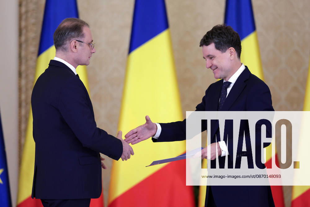 (261020) -- BUCHAREST, Oct. 20, 2026 -- Romanian President Nicusor Dan (R) shakes hands with Romania s new Prime Minister Luca during a swearing-in ceremony at the Cotroceni Palace in Bucharest, Romania, on Oct. 20, 2026. Romania s new government led by Luca Niculescu took the oath of office before Romanian President Nicusor Dan at the Cotroceni Palace on Tuesday evening. (Photo by Xinhua) ROMANIA-BUCHAREST-NEW GOVERNMENT CristianxCristel