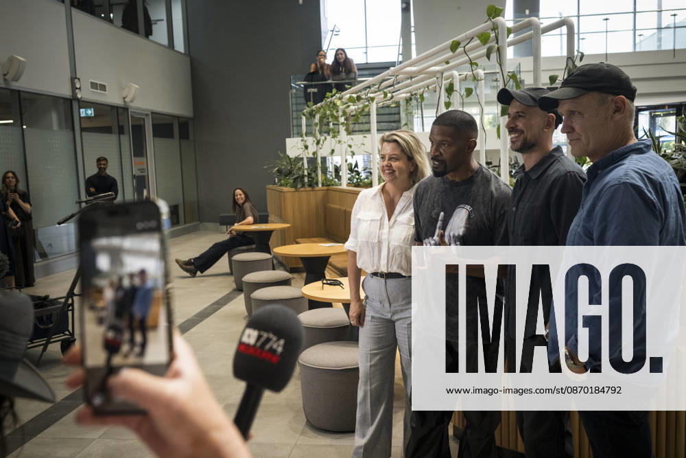 JAMIE FOXX DEADLOCKED, Jamie Foxx poses for a photo with Vicscreen CEO Caroline Pitcher and producers, (l-r) Fred Berger and Paul Currie on set of his new movie Deadlocked in Melbourne, Wednesday, October 21, 2026. ( NO ARCHIVING MELBOURNE VICTORIA Australia