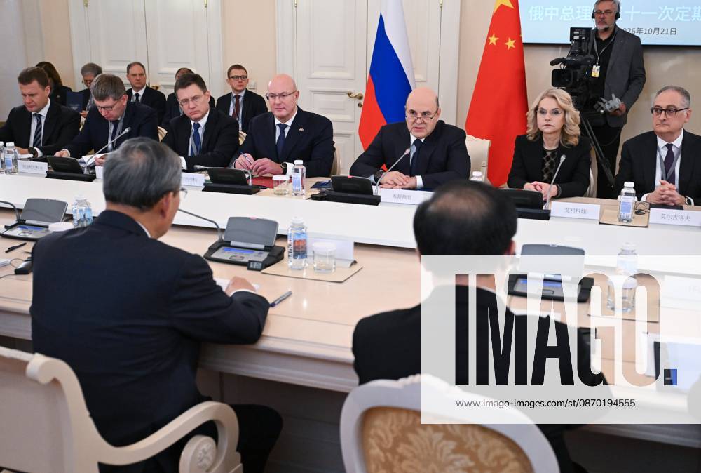 Russia China 9269449 21.10.2026 Russian Prime Minister Mikhail Mishustin attends a narrow format meeting with Chinese Premier Li Qiang, as Russian Minister for the Development of the Far East and the Arctic Alexey Chekunkov, Economic Development Minister Maxim Reshetnikov, Deputy Prime Ministers Alexander Novak, Tatyana Golikova and Russian Ambassador to China Igor Morgulov sit nearby, at the Boris Yeltsin Presidential Library in St. Petersburg, Russia. Alexander Miridonov Sputnik St. Petersburg Russia