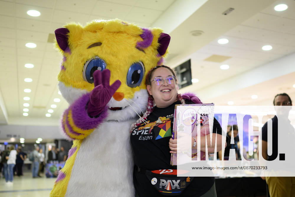 Feature: Meeps, the kitten mascot, with a visitor on October 21, 2026, at the SPIEL Essen trade show, held from October 22–25, 2026, in Essen, Germany, at the Grugahalle