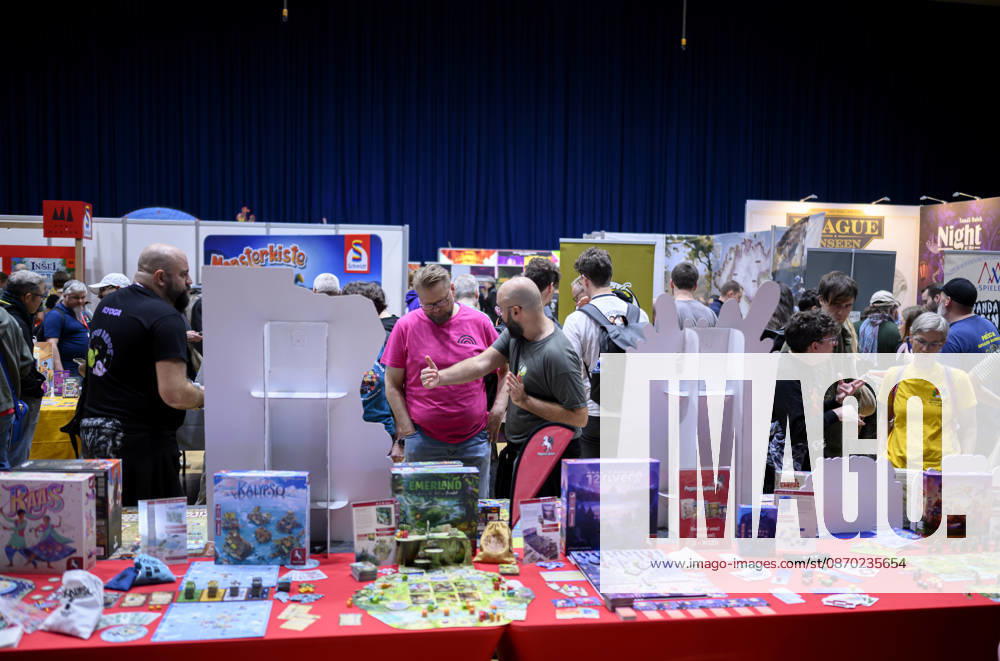 Feature: A look inside the New Products Hall; visitors are gathering information; October 21, 2026—SPIEL Essen trade show, October 22–25, 2026, in Essen, Germany, at the Grugahalle