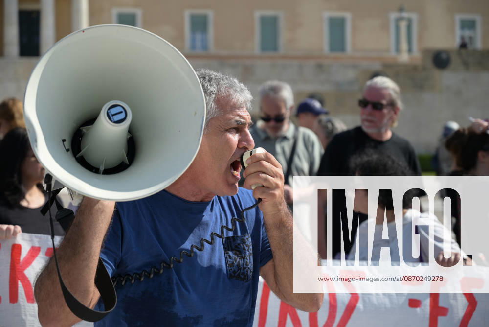 Students and teachers protest over education funding and living costs in Athens A teacher chants slogans using a megaphone outside the Greek Parliament during a demonstration by teachers and students demanding increased funding for public education and measures to address rising living costs. Athens Greece