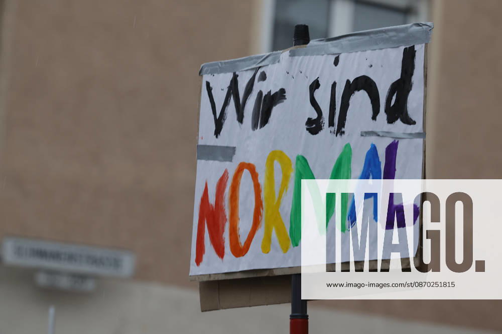 AfD Citizens’ Dialogue, October 21, 2026: The Alliance Against the Right is calling for a counter-demonstration against the AfD Citizens’ Dialogue organized by the Hessian AfD state parliamentary group, featuring state legislators Roman Bausch, Robert Lambrou, and Bernd Erich Vohl in Darmstadt-Eberstadt, Schwanenstraße, Ernst Ludwig Hall—here, a sign reading We Are Normal in colorful lettering—Darms