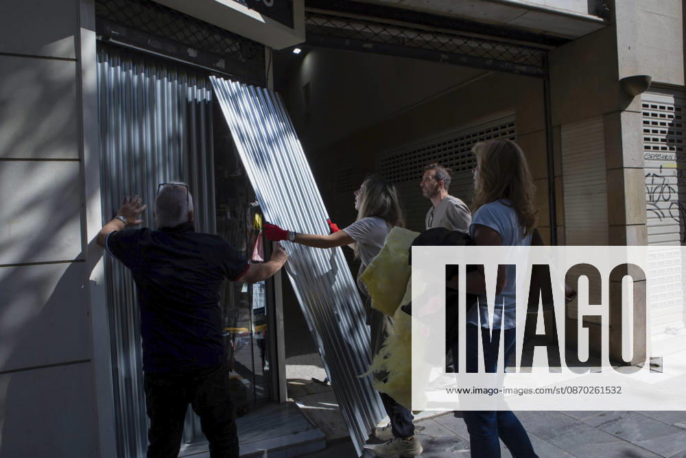 Athens Greece Living Costs Protest People install metal panels across shopfronts during a demonstration in Athens, Greece on October 21, 2026. Students and other demonstrators marched through central Athens to protest rising living costs and economic pressures. Organizers say the concerns raised by participants echo grievances voiced during recent demonstrations in France. Athens Attica Greece