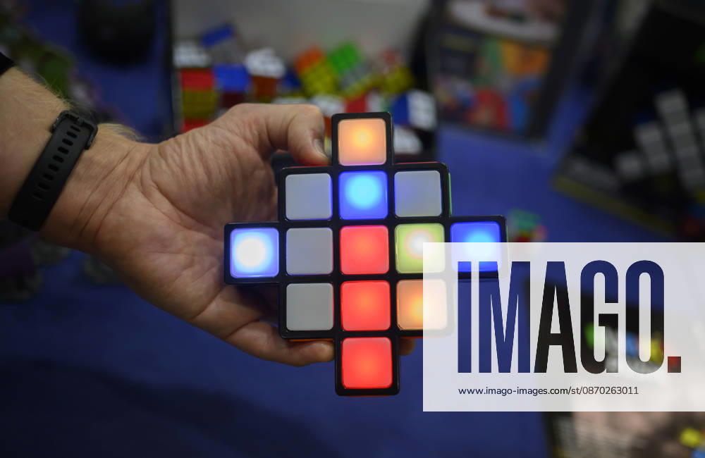 A hand holds the game Rubik s Rush, an electronic color and reaction game, at the New Product Showcase on October 21, 2026, at the SPIEL Essen trade show, October 22–25, 2026, in Essen, Germany, at the Grugahalle.