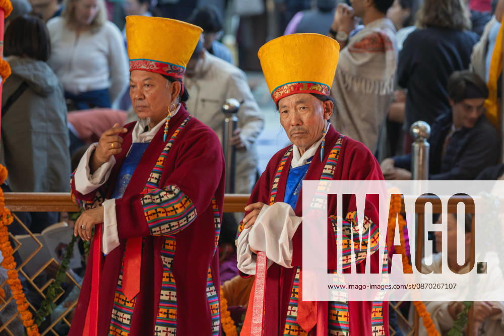 Exiled Tibetans in ceremonial costumes wait to welcome Tibetan Spiritual leader the Dalai Lama during a Long Life Prayer offered to him by TIPA, Norbulingka Institute and Nepal Tibetan Lhamo Association at Tsuglakhang Temple, Mcleodganj, Dharamshala on Wednesday. Dharamshala India - ZUMAb235 20261021_zip_b235_014