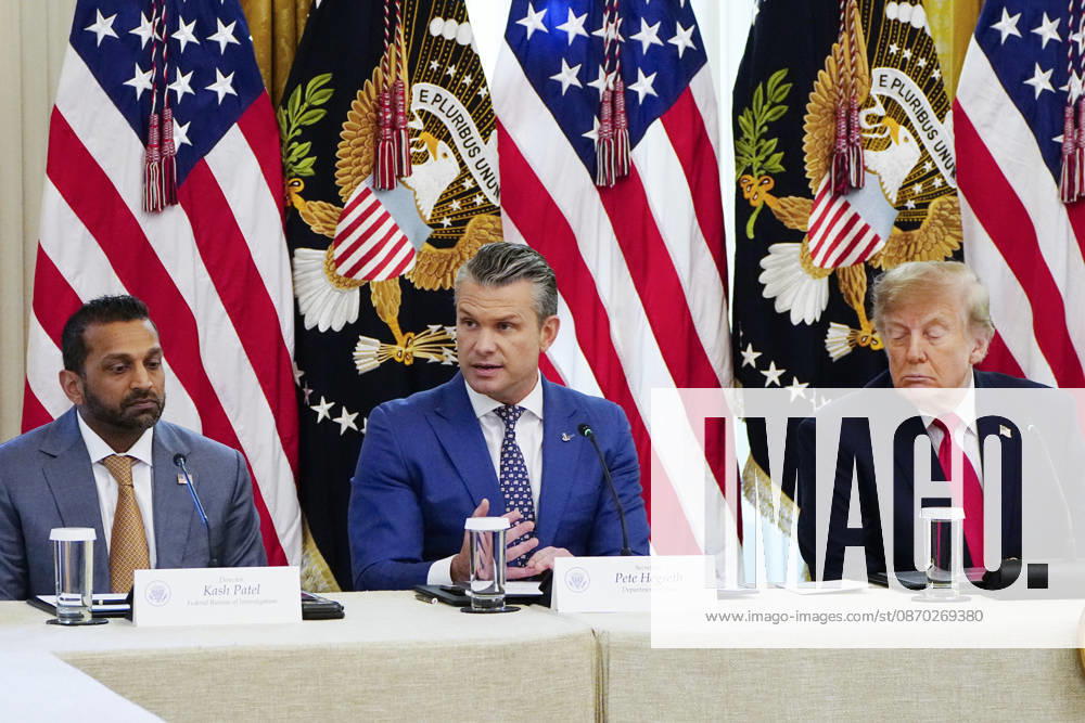 Defense Secretary ?Pete Hegseth speaks as President Donald Trump (R) and FBI Director Kash Patel (L) listen during a roundtable discussion on cybercrime in the East Room of the White House in Washington, DC on Wednesday, October 21, 2026. The discussion focuses on combatting foreign-based organized crime targeting Americans online and federal seizures of fraudulent crypto and scam websites. WAP20261021914 BONNIExCASH